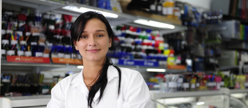 Woman standing in front of retail counter